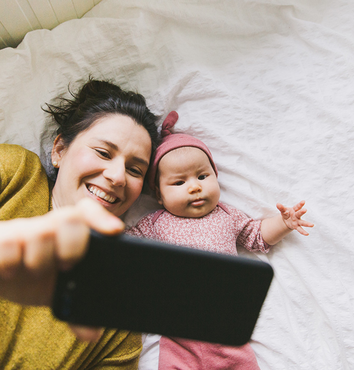 mother with baby taking selfie