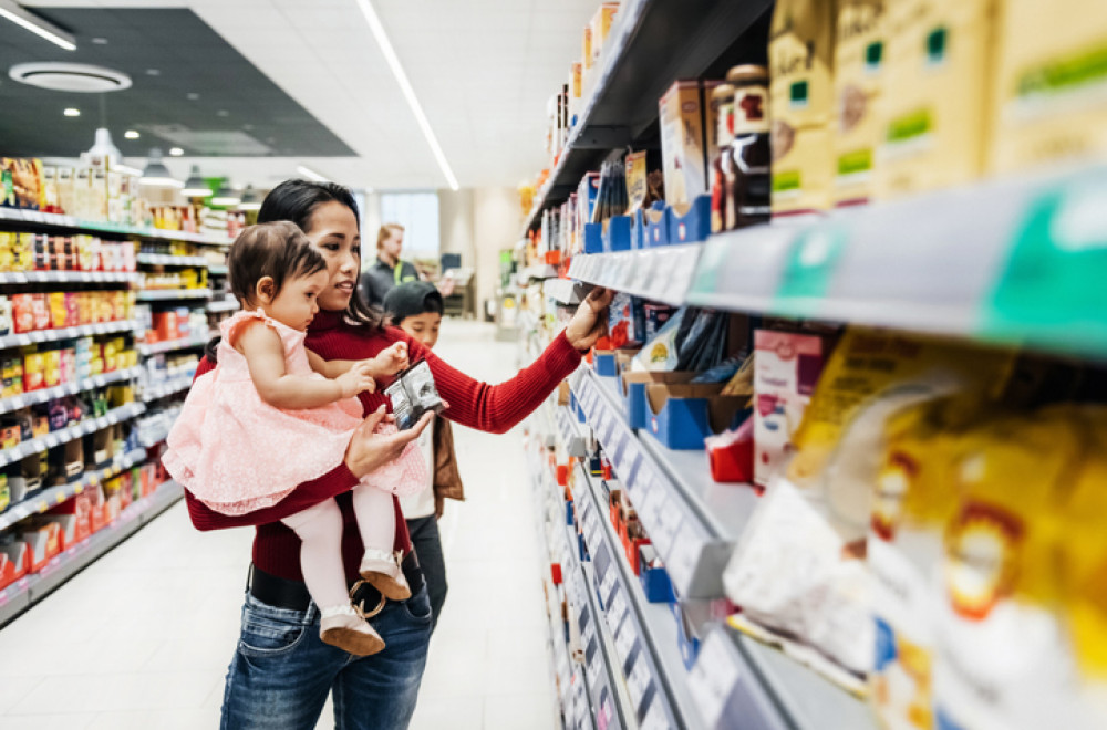 Woman with child in supermarket